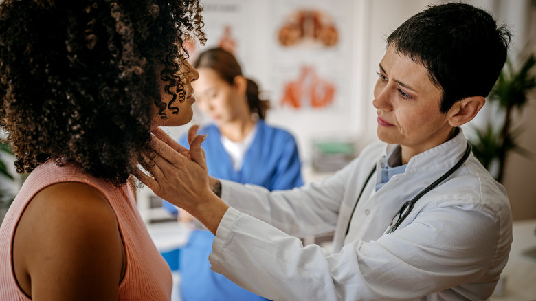 A doctor examining a patient