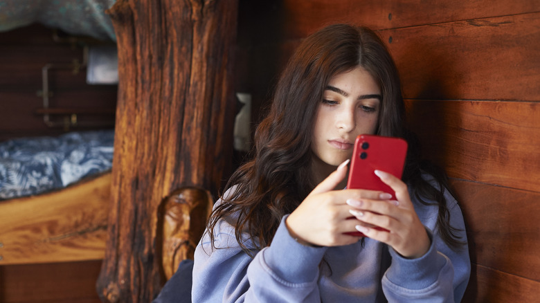 A traveler looking at their phone