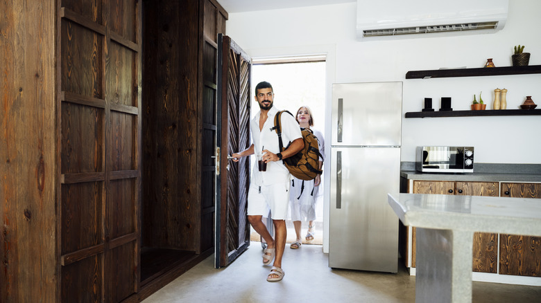 People entering the Airbnb they rented for vacation