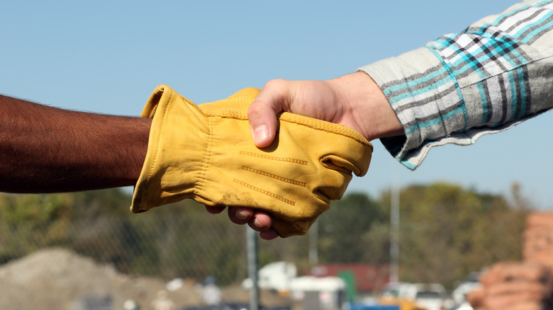 two people shaking hands 
