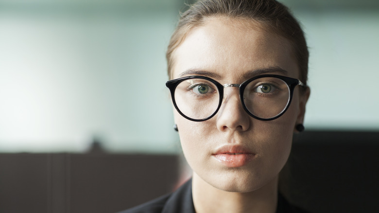 Woman with emotionless expression 