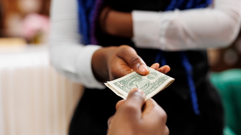 Traveler tipping resort staff