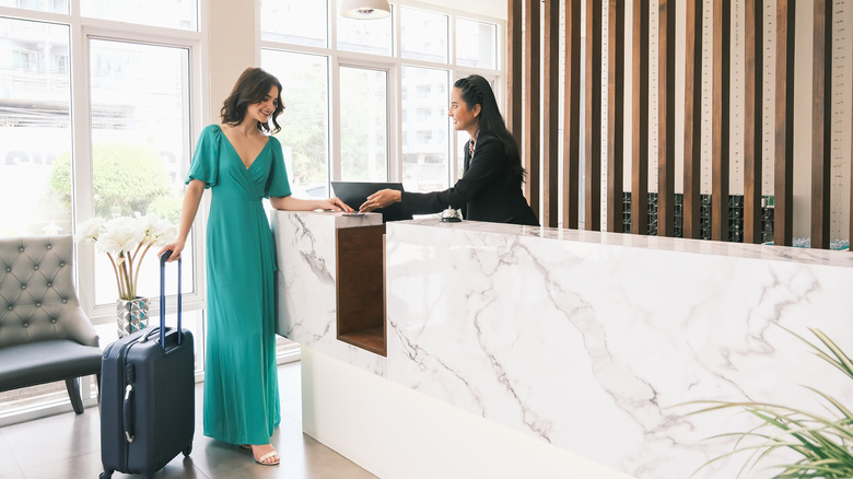 Traveler talking to a concierge