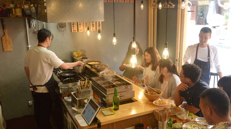 friends eating at japanese restaurant 