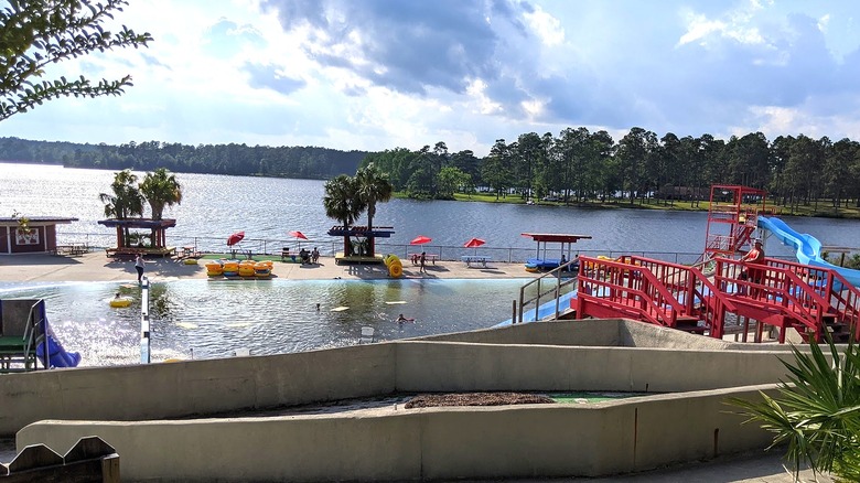 The Splash of Fun Water Park with slides and a pool next to a reservoir in Wiggins, Mississippi