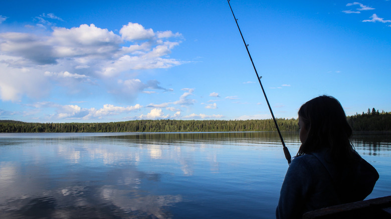 A person fishing at McLeod Lake at Carson-Pegasus Provincial Park, Alberta
