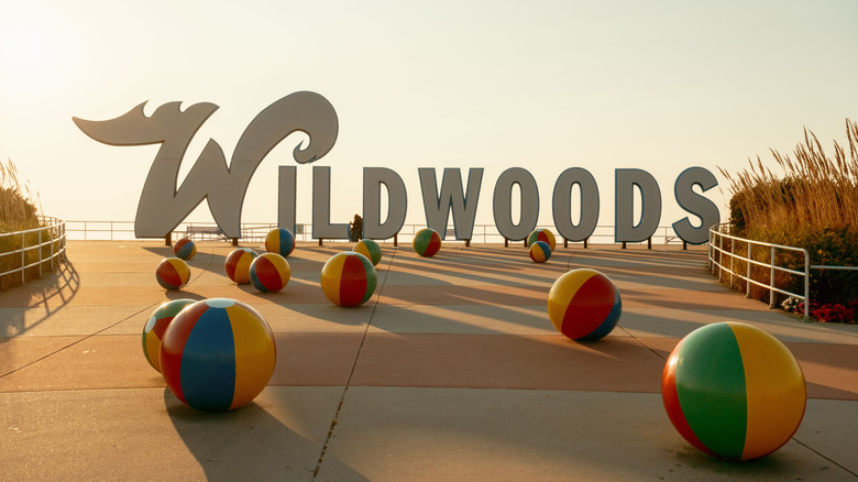 Large Wildwoods signage with beach ball sculptures in the foreground, Wildwoods Boardwalk, New Jersey