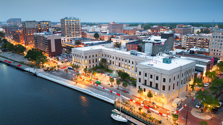 View of Wilmington, North Carolina's cityscape and Riverwalk at dusk