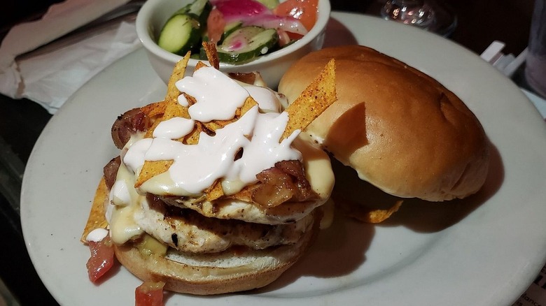 Nacho chicken burger plate with side of fries at Front Street