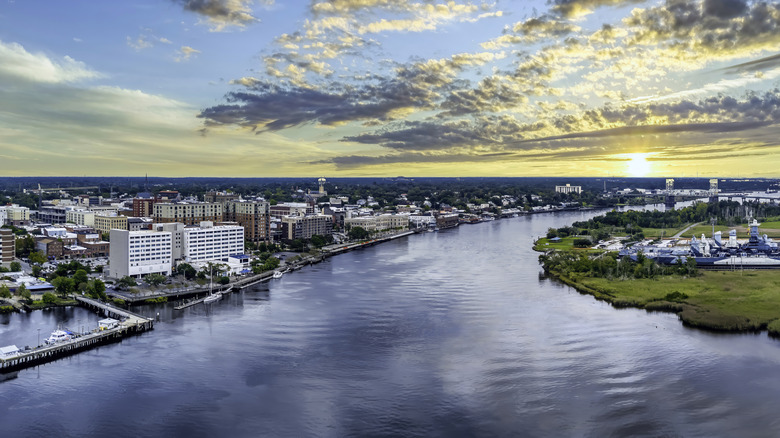 Aerial view of Wilmington with river flowing through at sunset on a bright day