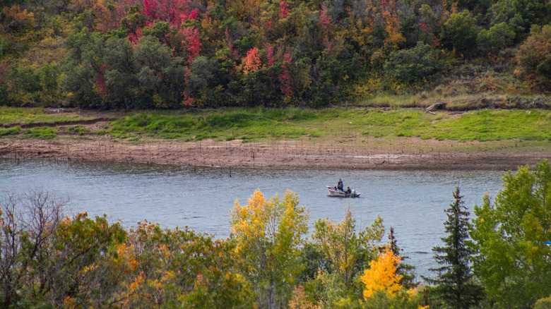 People in a fishing boat on a river near Park City, Utah