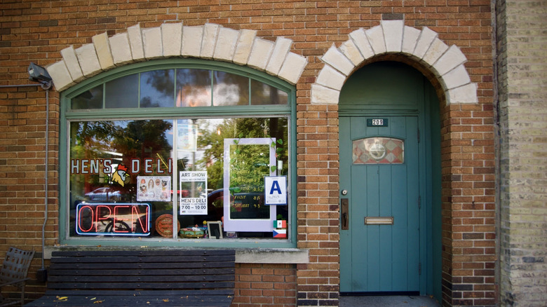 Exterior of Hen's Deli, with an "Open" sign