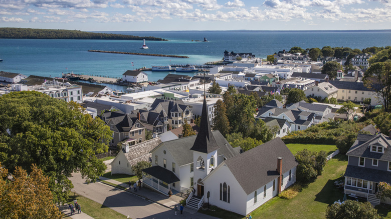 Aerial view of church, historic buildings, and Lake Huron on Mackinac Island, Michigan