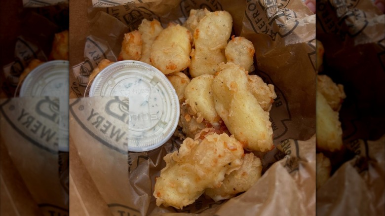 basket of fried cheese curds with sauce