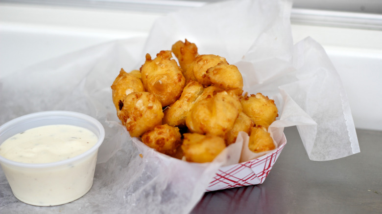basket of fried cheese curds with ranch dressing