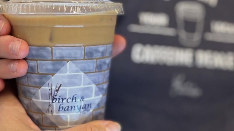 A drink from Birch & Banyan in a plastic cup