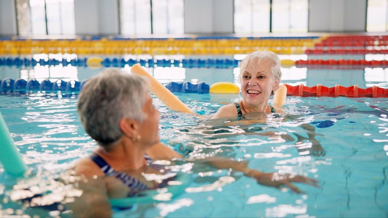 Two senior citizens in a pool