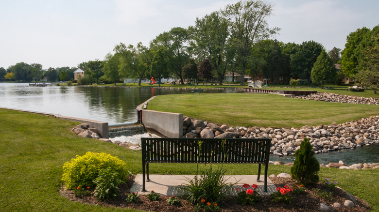 Bench and flower beds at Playground Park in Green Lake