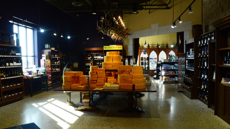Table covered in large pieces of cheese in a castle interior