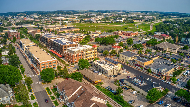 Aerial view showing buildings, houses, and streets of a suburb