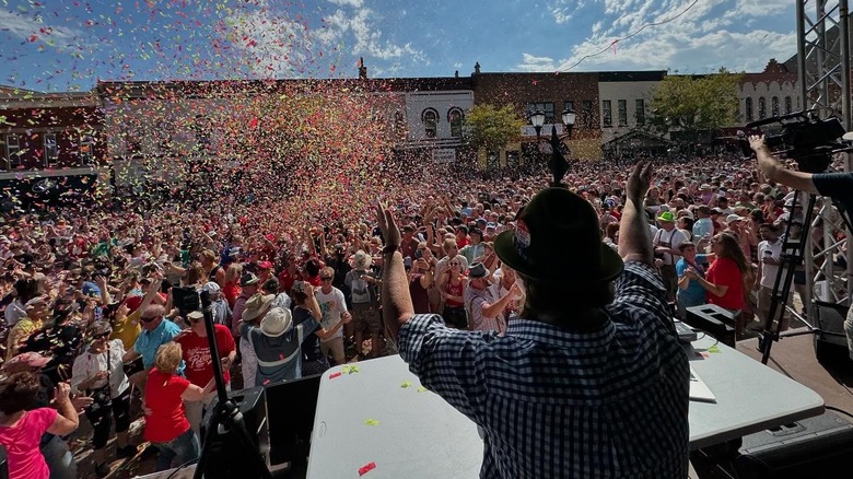 DJ Shotski looks out over the crowd as they break the worlds largest polka dance record at Green County Cheese Days