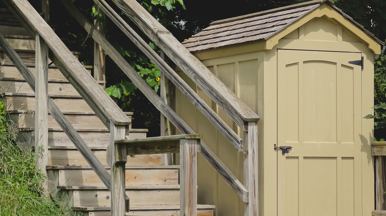 Landscape photo of wooden stairway next to shed on summer day in Mineral Point, Wisconsin