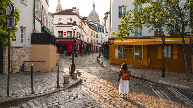 A woman walking on a street in Europe
