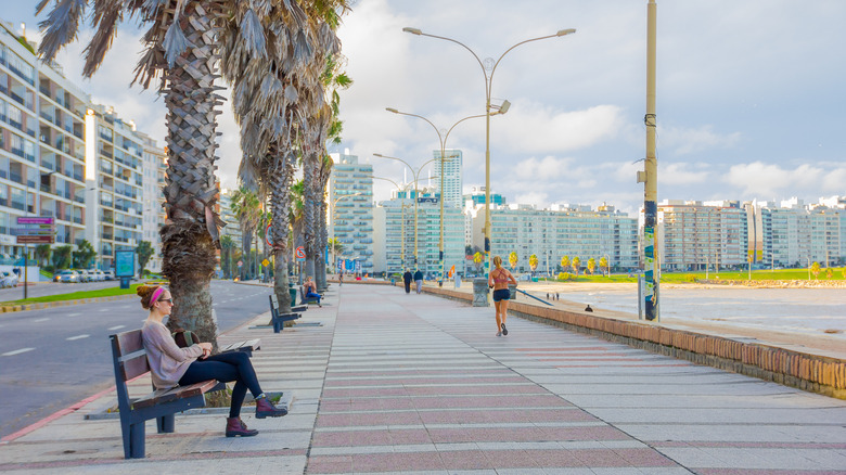 People enjoying La Rambla boardwalk in Montevideo, Uruguay