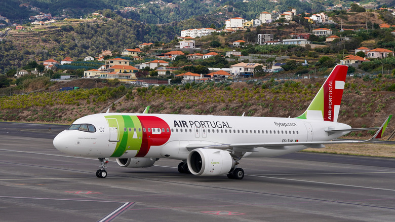 plane on Madeira / Cristiano Ronaldo International Airport runway