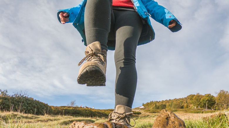 Hiking on a mountain and stepping on a poop