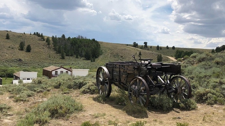 An old wagon sits amongs the sagebrush in South Pass City, Wyoming