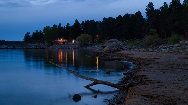 View of water and cabins at Keyhole State Park, after sunset