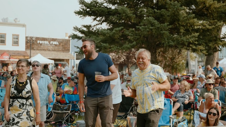 People drinking, dancing, and listening to live music at the Oyster Ridge Music Festival, Kemmerer, Wyoming