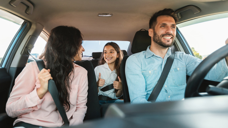 A family talking and driving