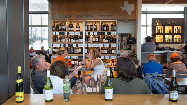 Customers sit at Vino Volo at Austin-Bergstrom International Airport