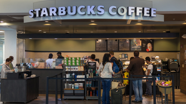 Travelers at Starbucks in Miami International Airport