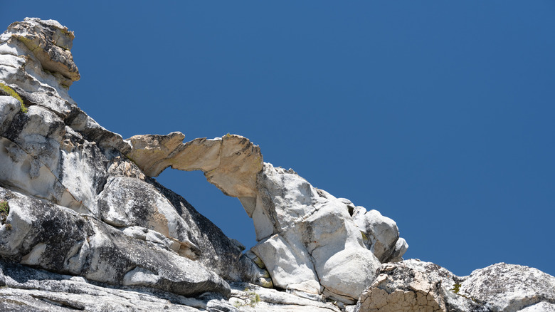 A view of Yosemite's Indian Rock Arch against a clear blue sky