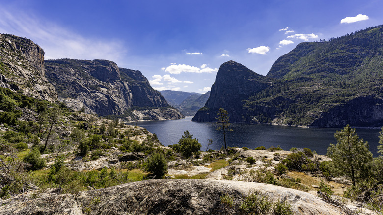Granite mountains tower over the Hetch Hetchy Valley in Yosemite
