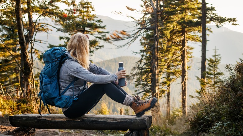 A woman camping in a forest