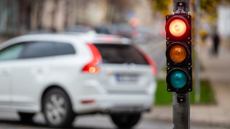 A traffic light and a car turning left