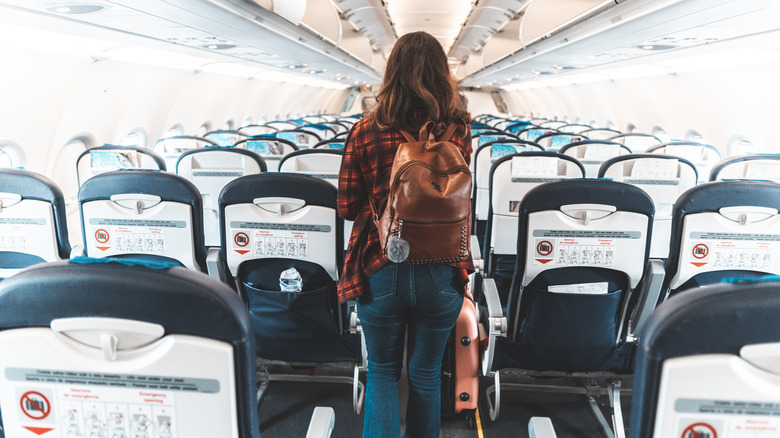 Woman boarding an airplane