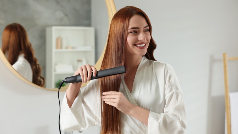 Woman using a hair iron