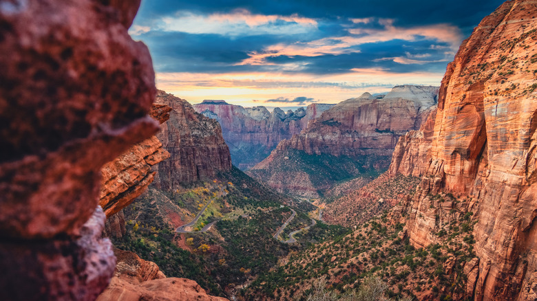 A variegated sky over a view of the red rocks of Zion Canyon from Canyon Overlook