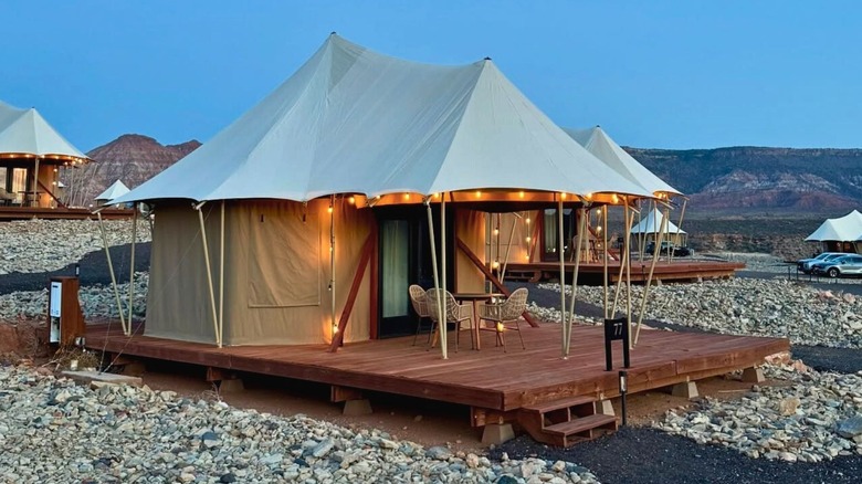 Luxury glamping tent set against desert mountains at Zion Wildflower Resort near Zion National Park in Utah