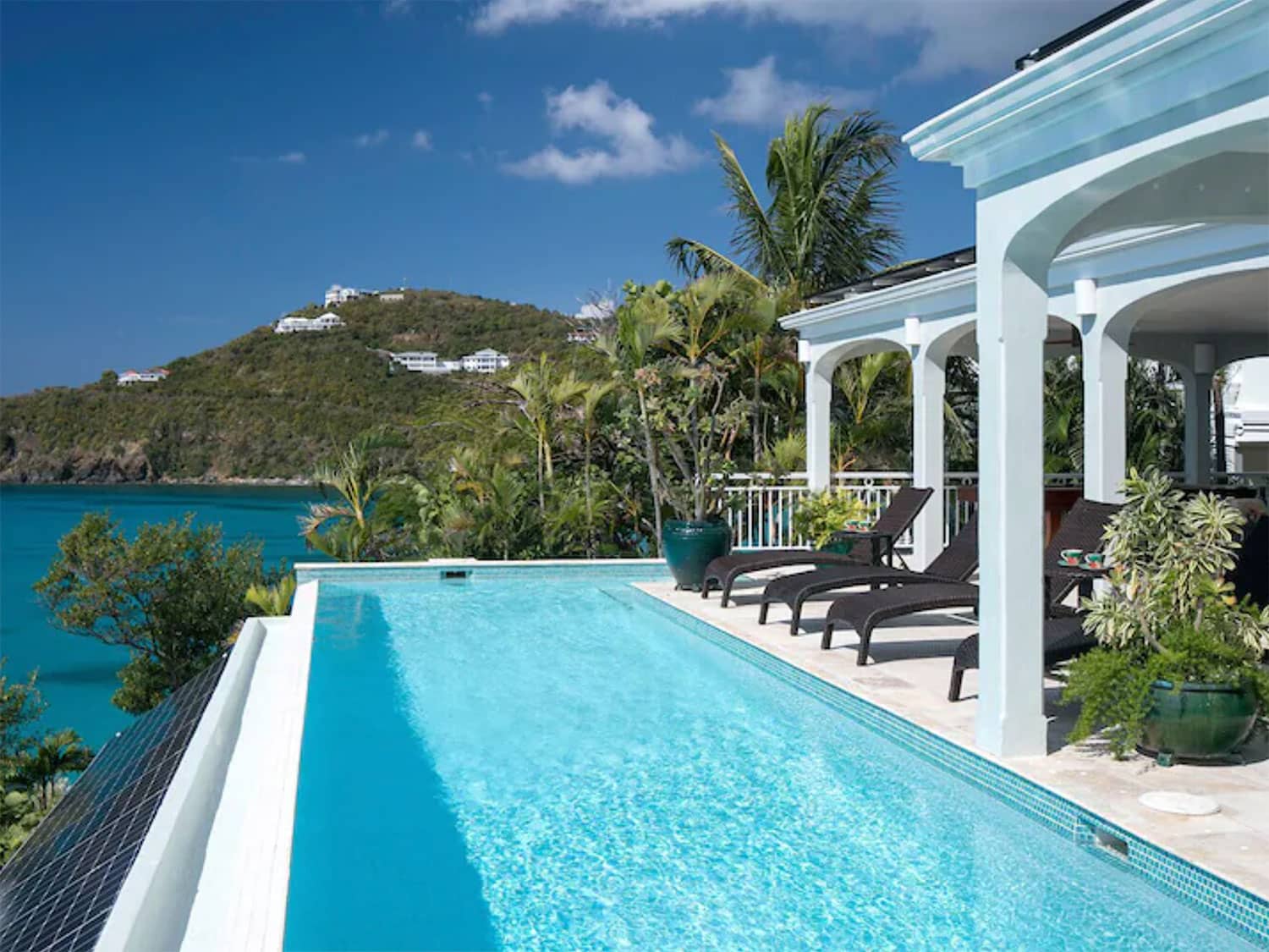 A beach side resort-style home with an outdoor pool.