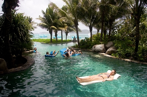 The beachside pool extends into a lavish grotto on Necker Island.