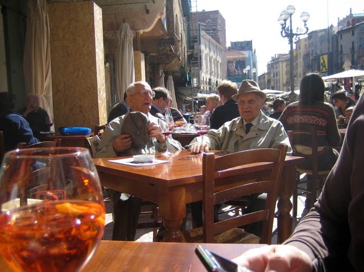 Old friends drinking Spritzer in Verona
