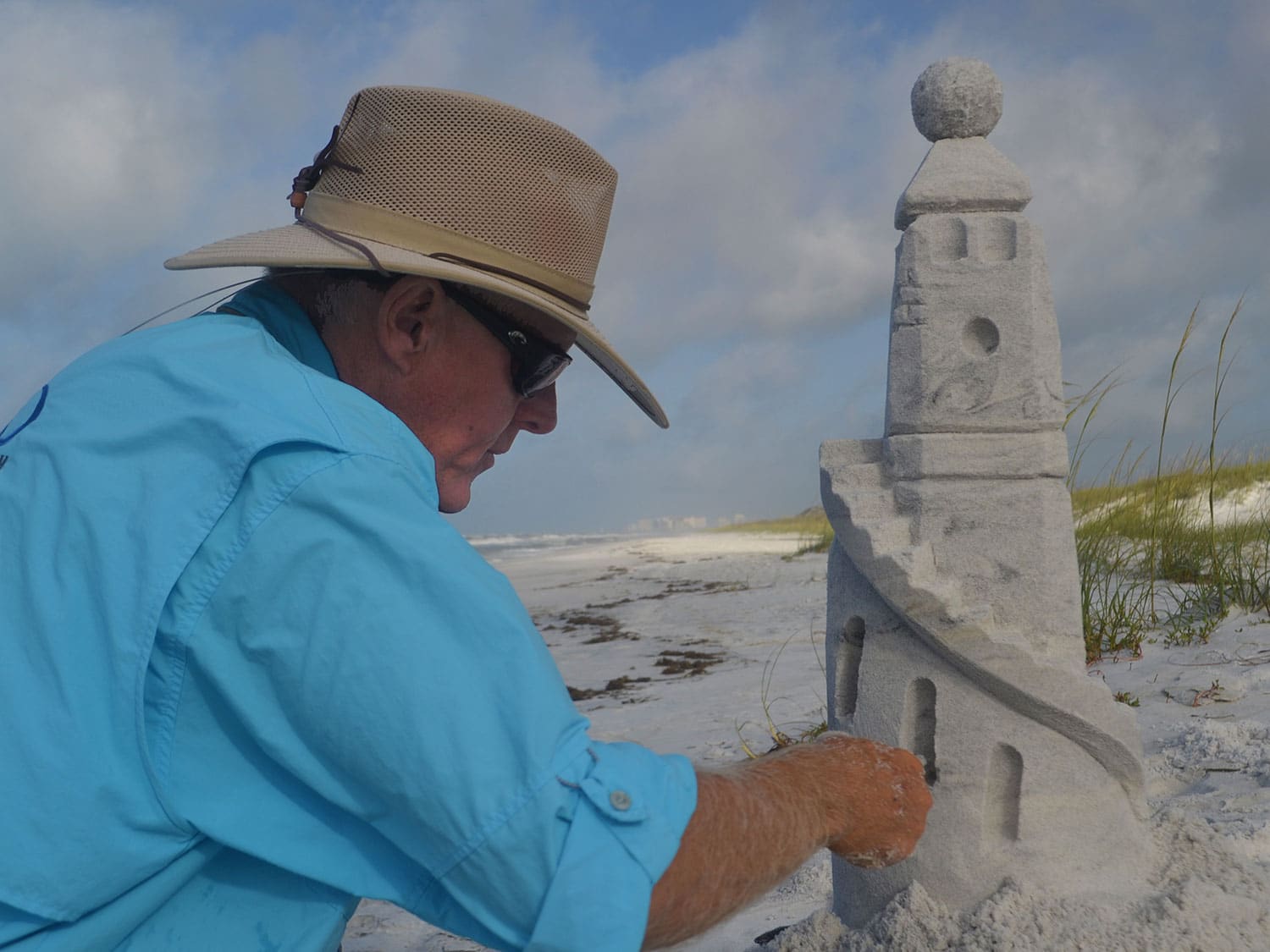 Rick Mungeam building an intricate sand sculpture