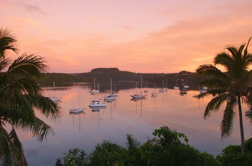 Tonga islands sunset and sailboats