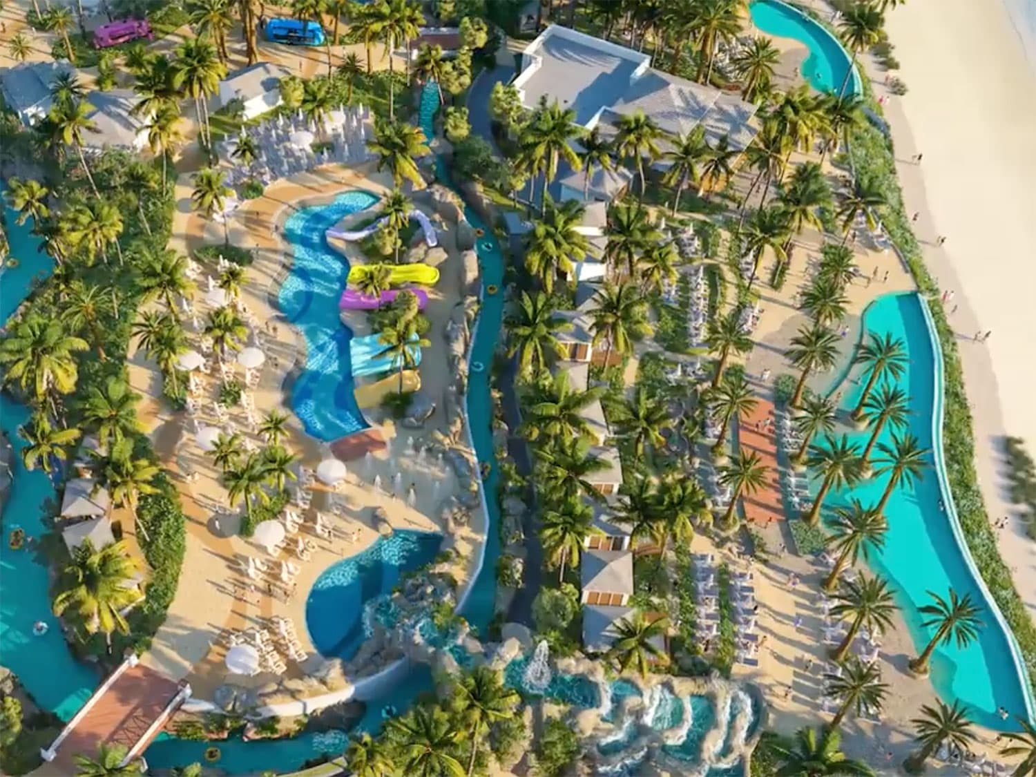 Aerial photograph of a beach-side resort water park with a lazy river.